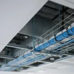 Cable fire ratings — network cables with different jacket types coiled in a commercial building ceiling void