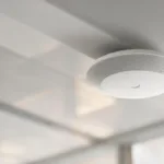 Wi-Fi 8 explained for UAE businesses — enterprise access point in a modern office ceiling